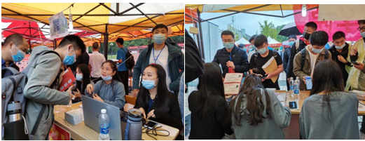 (图为公司高年级员工为新生现场答疑)
